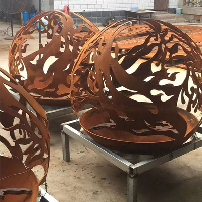 Phoenix Pattern Steel Fire Pit ลานกลางแจ้ง Corten Sphere Firepit สำหรับสวนร้อน